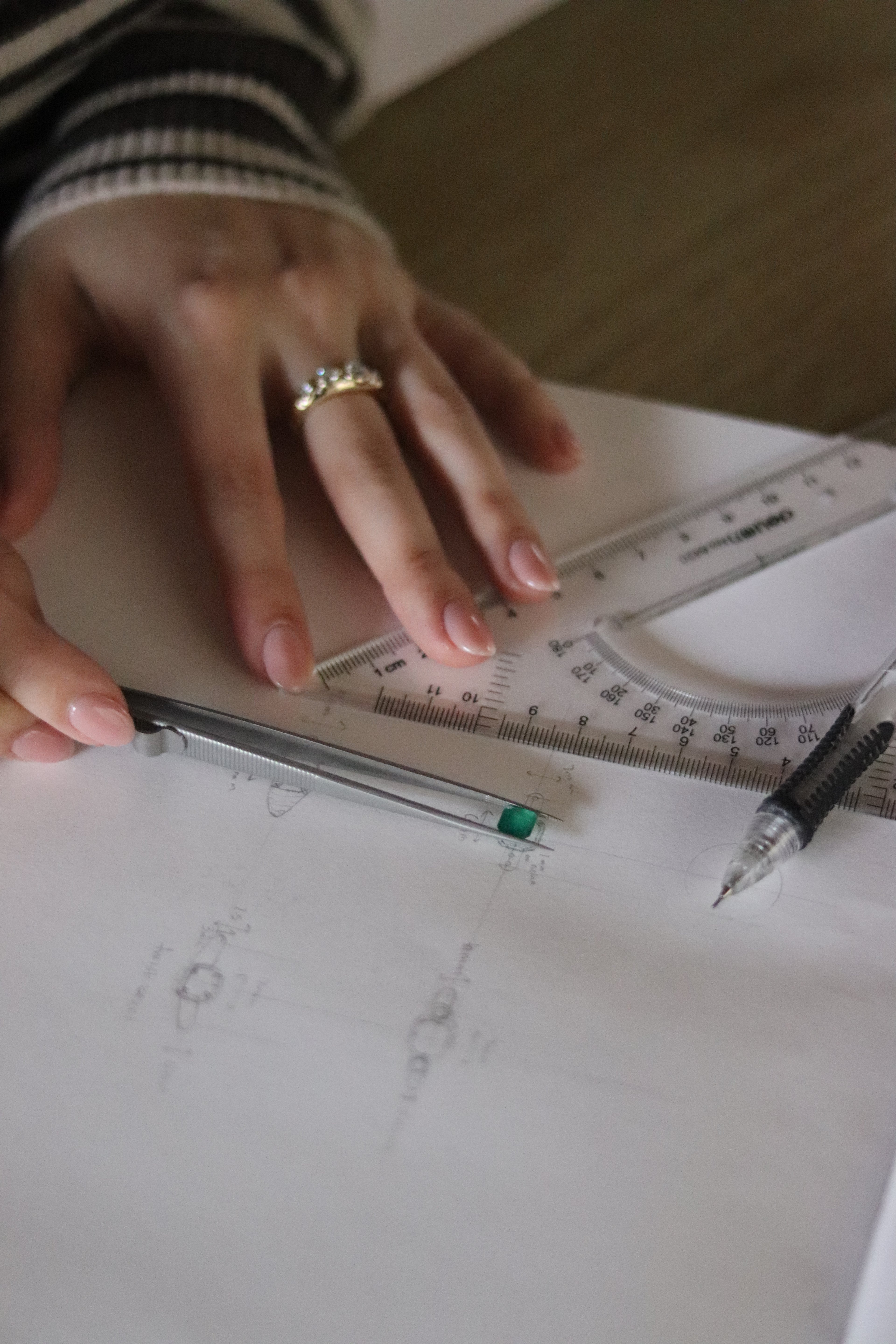 Step Four - Using the final selected gemstone’s proportions and dimensions, Kiersten will bring the design details to life through a series of sketch options, refining elements of the setting, balance, and overall aesthetic. Once a final design is approved, it will be translated into a detailed computer-aided design (CAD) model to prepare the piece for production.